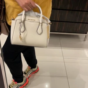 Michael Kors white hand bag..
