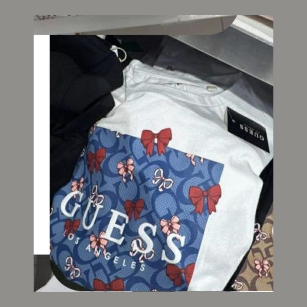 Guess Women's T-shirt with Bow Print - White with Blue Pattern - Size medium